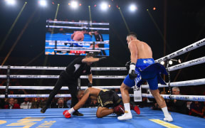 Joseph Parker looks on after knocking Faiga Opelu down, Melbourne 2023.