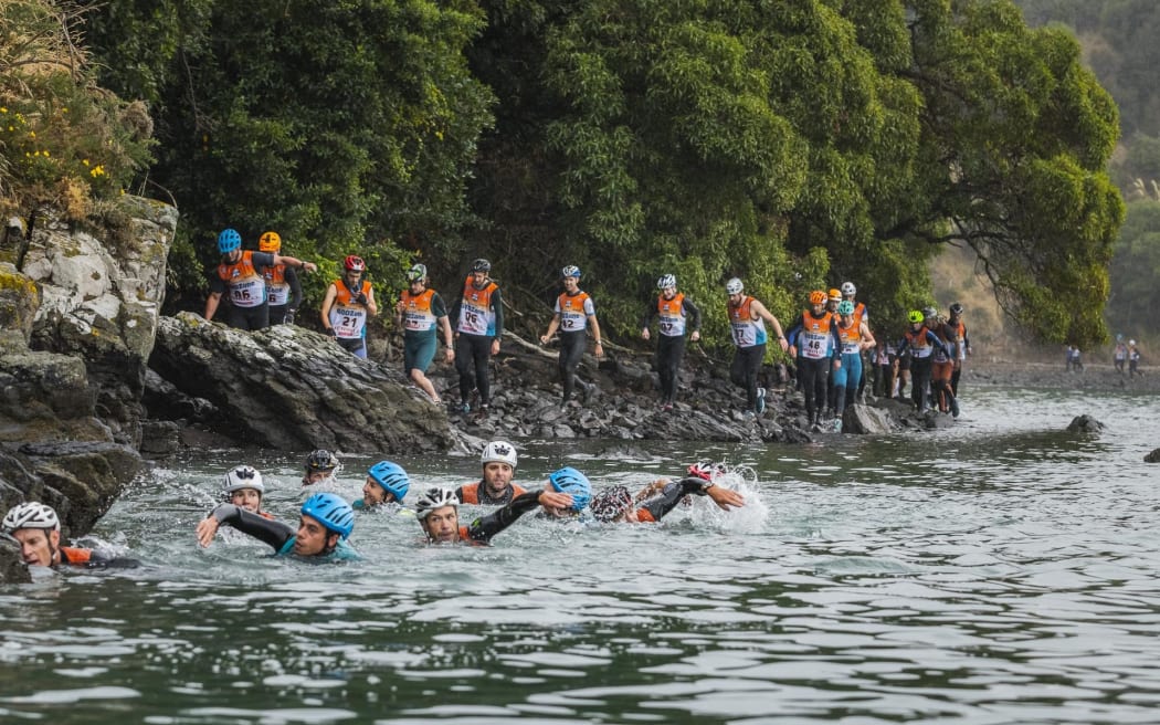 Competitors take to the water in Akaroa as part of the NZ Godzone adventure race (2019)