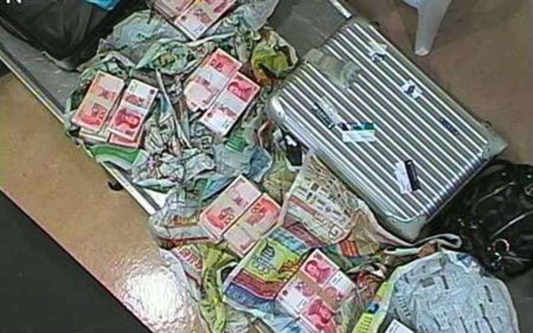 New Zealand Customs intercepted bags of cash - 700,000 Chinese yuan in total.
