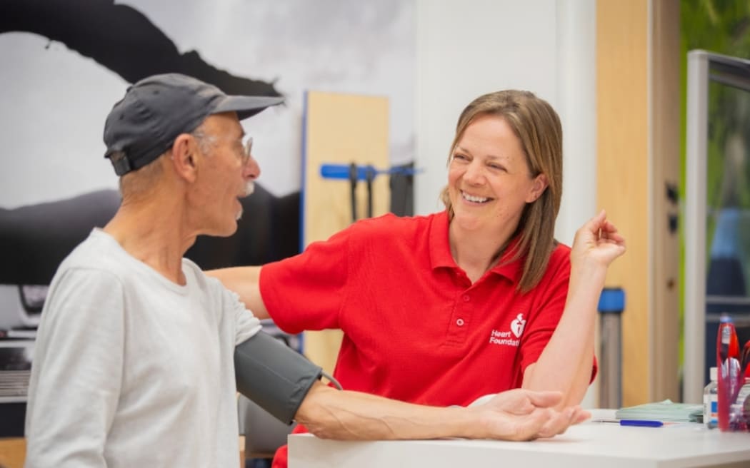 Picture of man getting blood pressure tested