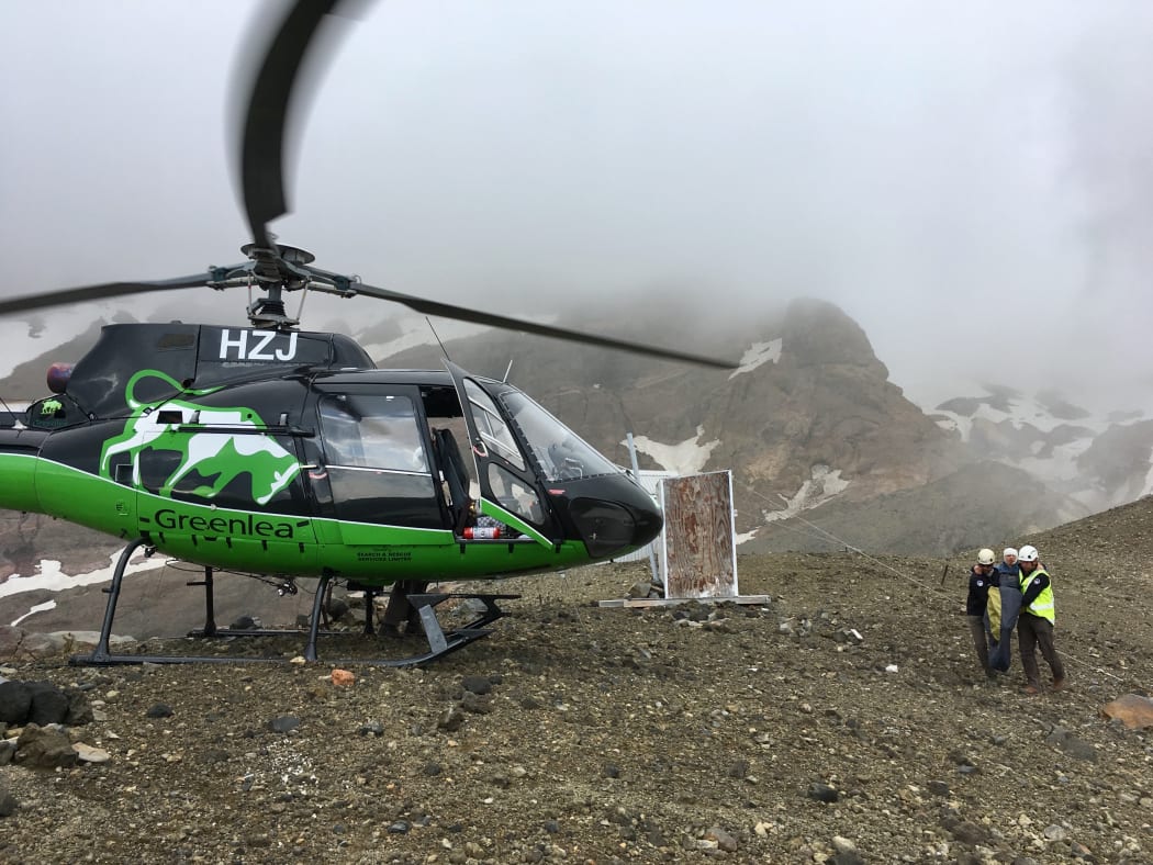 Rescuers helped the woman to a rescue helicopter at first light