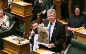National's Maurice Williamson shows a picture of his dog during his valedictory statement to the House.