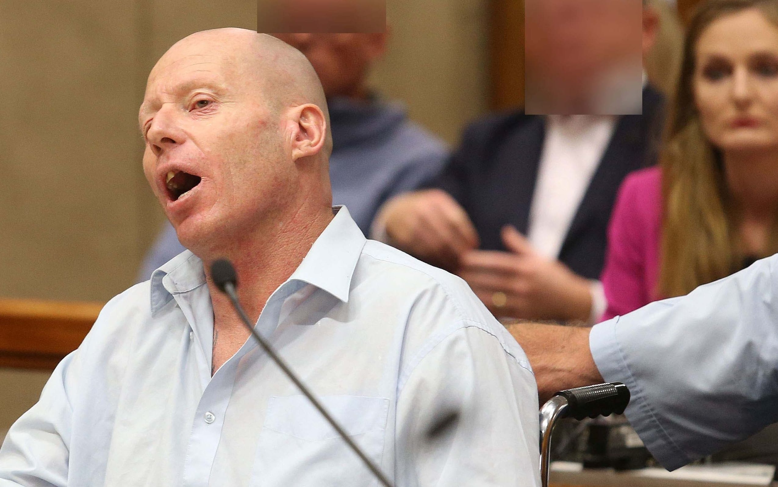 Russell Tully shouts over the judge in court.