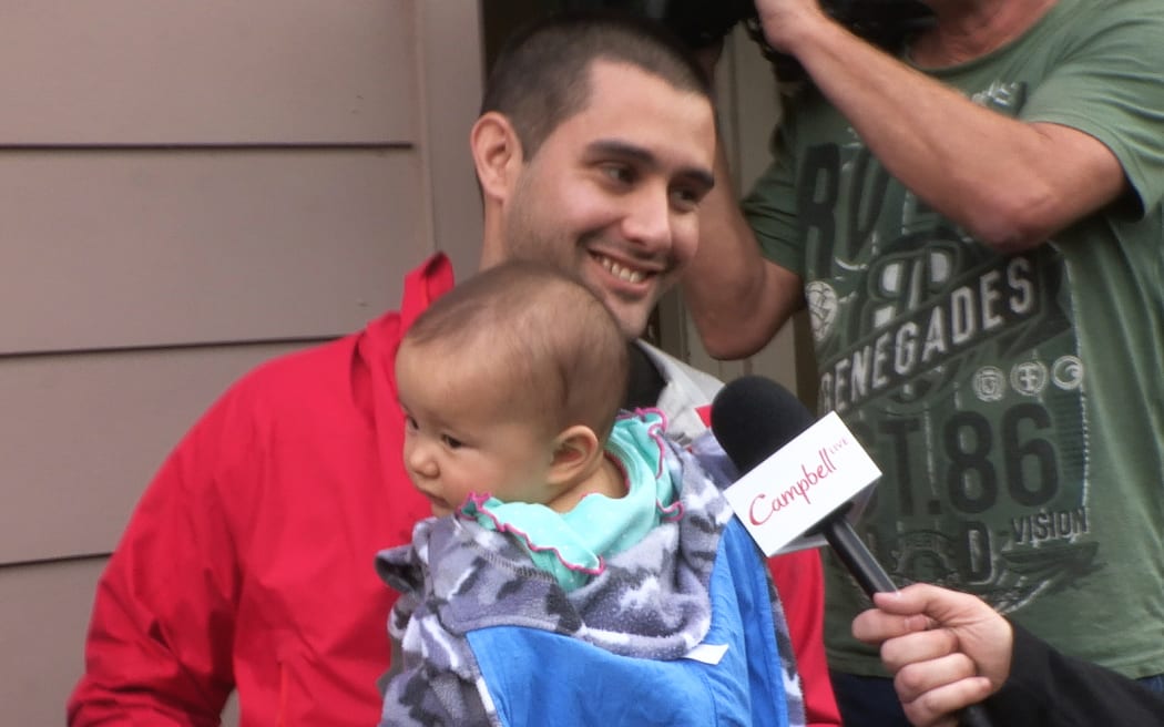 Daniel O'Brien and his young hungry baby after his mother was lost over night.