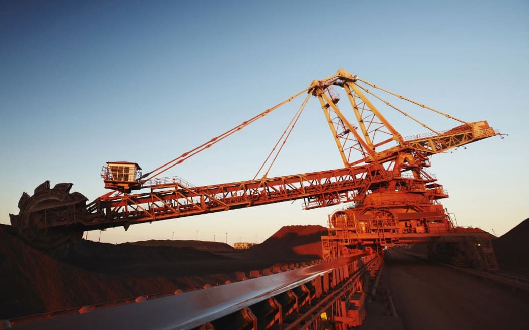 Port Hedland is the world's biggest export point for iron ore and is used by BHP Group, Fortescue and billionaire Gina Rinehart's Hancock Prospecting.
This undated handout photo taken and released in 2010 by Anglo-Australian mining giant BHP Billiton shows iron ore stockpiling operations in Port Hedland, western Australia. BHP Billiton announced on July 15, 2011 a 12 billion USD takeover of US firm Petrohawk Energy that will give it access to the lucrative US shale gas market.  AFP PHOTO / HO / BHP BILLITON (Photo by BHP BILLITON / AFP) / RESTRICTED TO EDITORIAL USE - MANDATORY CREDIT "AFP PHOTO /BHP BILLITON" - NO MARKETING - NO ADVERTISING CAMPAIGNS - DISTRIBUTED AS A SERVICE TO CLIENTS