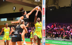 Jamaica's Jhaniele Fowler scores against New Zealand's Karin Burger during their bronze medal play-off in the Netball World Cup in Cape Town on 06 August 2023.