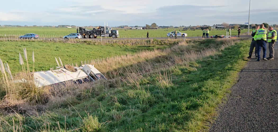 The overturned bus near Sanson.