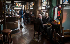 Clients visiting Lismore pub in Glasgow.  PM Nicola Strugeon announced on the same day new circuit breaker restrictions affecting pubs and restaurants to counter COVID-19 pandemic for two weeks starting Friday night.