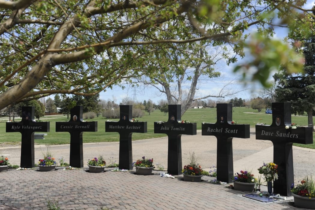 Crosses with the names and portraits of the victims of the 1999 Columbine High School massacre are seen at the Chapel Hill Memorial Gardens in Littleton, Colorado on April 20, 2019.