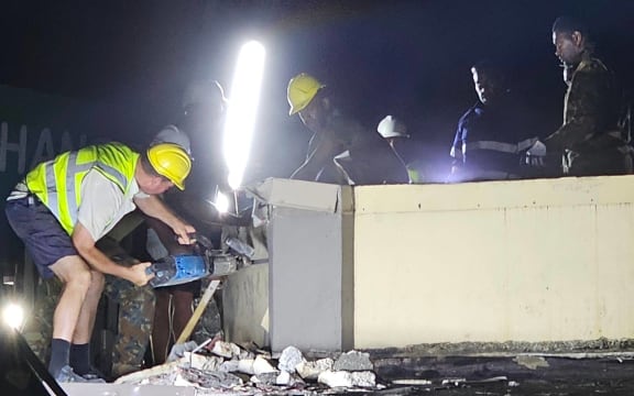 Rescuers search damaged buildings in Vanuatu for anyone trapped after the 7.3 earthquake.