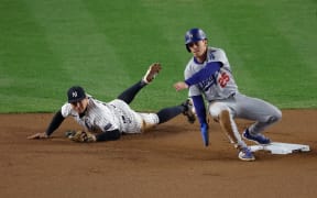 Tommy Edman #25 of the Los Angeles Dodgers steals second base during the seventh inning of Game Four of the World Series at Yankee Stadium.