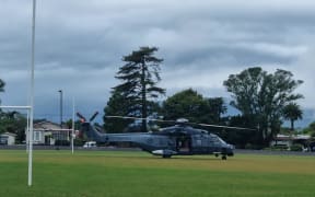 A NZDF helicopter lands at Victoria Square, Westport, to aid in relief efforts after heavy rain threatened to flood some areas in early February.
