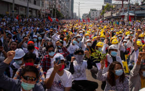 Protesters take part in a demonstration against the military coup in Mandalay, 22 February 2021.
