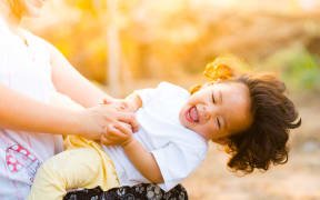 happy kid with mother