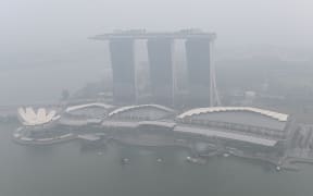 This overview shows the Marina Bay Sands hotel and resort blanketed by haze in Singapore on September 18, 2019.