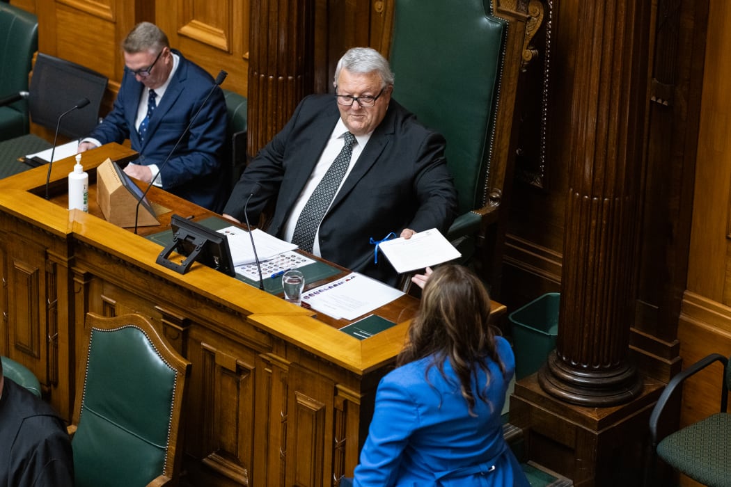 Nicola Willis hands the Speaker a copy of the 2024 Budget Statement.