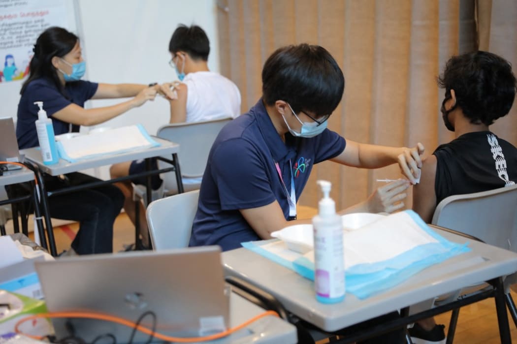 Students getting their vaccinations at the dedicated  Ministry of Education (MOE) vaccination centre at ITE College Central, 7 June 2021.
