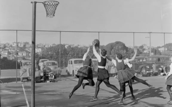 Action in gym slips and stockings, Tech Old Girls vs St Mary’s Wellington, 1955