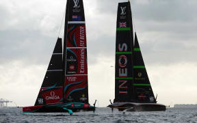 Britain's Ineos Britannia (R) and defender Emirates Team New Zealand compete on day 1 of the Louis Vuitton 37th America's Cup Match, off the coast of Barcelona on October 12, 2024. (Photo by Manaure Quintero / AFP)