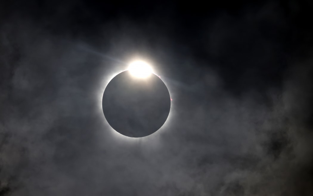 The diamond ring effect is seen as the moon eclipses the sun on April 8, 2024 in Fort Worth, Texas.
