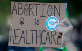MIAMI, FLORIDA: JUNE 24: People join together to protest against the Supreme Court's decision in the Dobbs v Jackson Women's Health case on June 24, 2022 in Miami, Florida. The Court's decision in the Dobbs v Jackson Women's Health case overturns the landmark 50-year-old Roe v Wade case, removing a federal right to an abortion.   Joe Raedle/Getty Images/AFP (Photo by JOE RAEDLE / GETTY IMAGES NORTH AMERICA / Getty Images via AFP)
