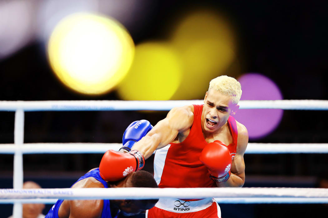David Nyika of New Zealand competes against Cheavon Clarke of England at the Men's 91kg Semifinal.