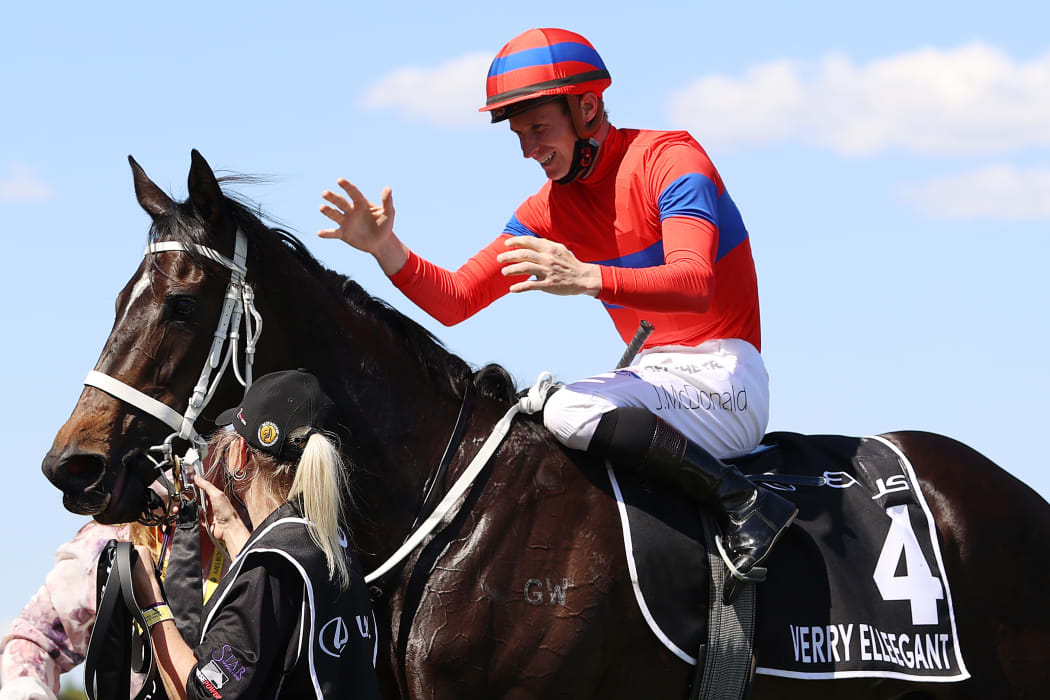 James Mcdonald riding #4 Verry Elleegant celebrates after winning race 7, the Lexus Melbourne Cup during 2021 Melbourne Cup Day at Flemington Racecourse on November 02, 2021 in Melbourne, Australia.