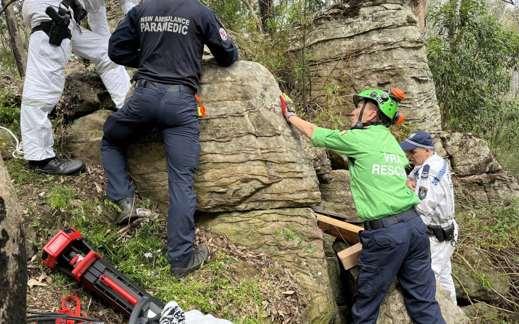The 23-year-old had been walking with friends when she dropped her phone between rocks.