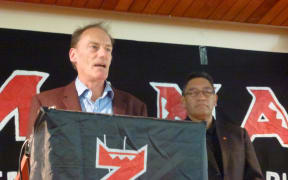 John Minto at the podium with Mana Party leader Hone Harawira.