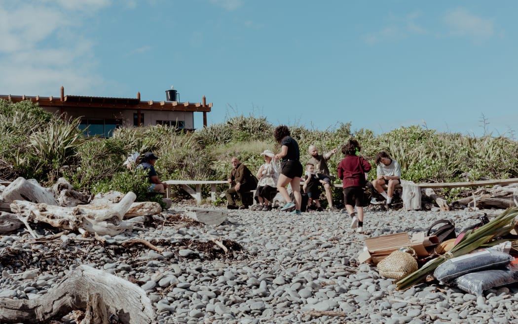 The Barrett family on the beach in Kāpiti
