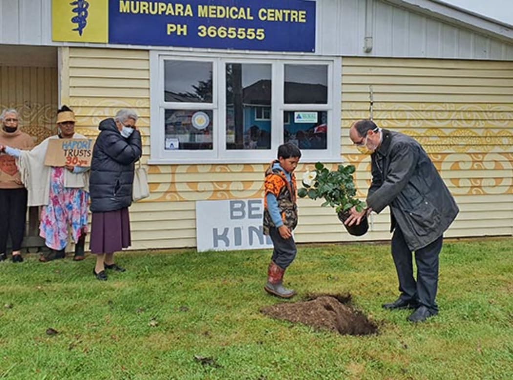 Dr Bernard Conlon plants a rose in front of his Murupara Medical Clinic during a rally in his support in November.