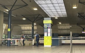 Emergency tape blocking the entrances to Lower Hutt’s Waterloo Station. Police officers are stationed.