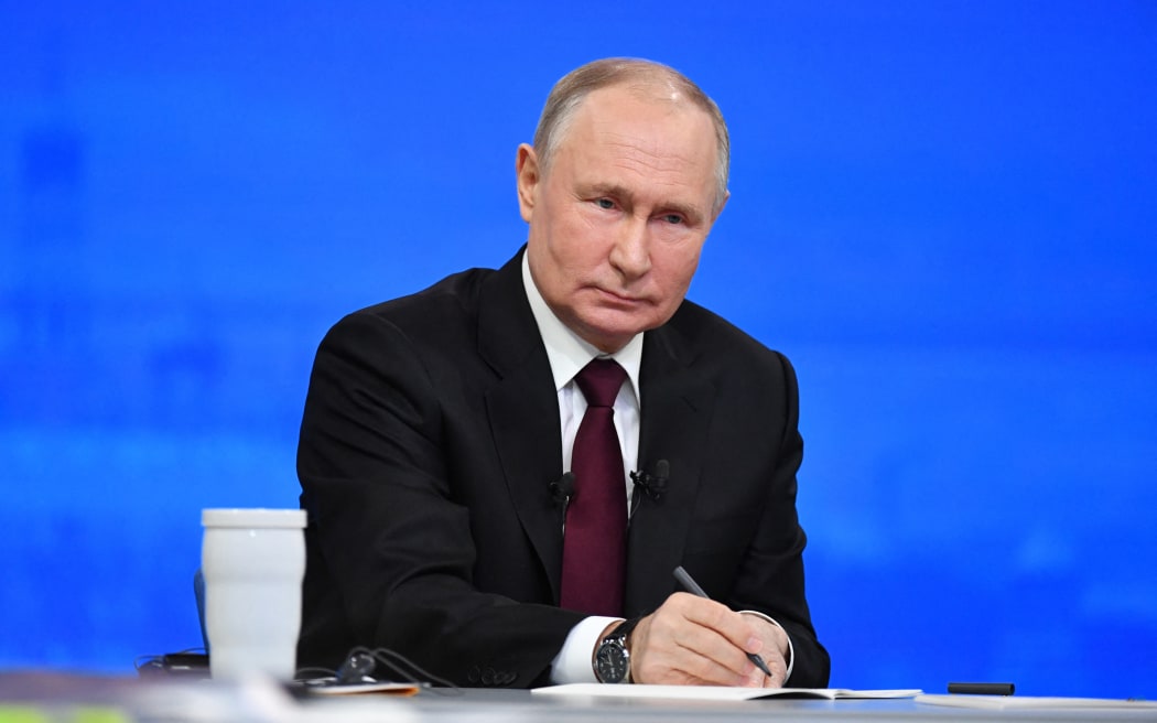This pool photograph distributed by Russia's state agency Sputnik shows Russian President Vladimir Putin holding his year-end press conference at Gostiny Dvor exhibition hall in central Moscow on December 14, 2023. (Photo by Alexander KAZAKOV / POOL / AFP)