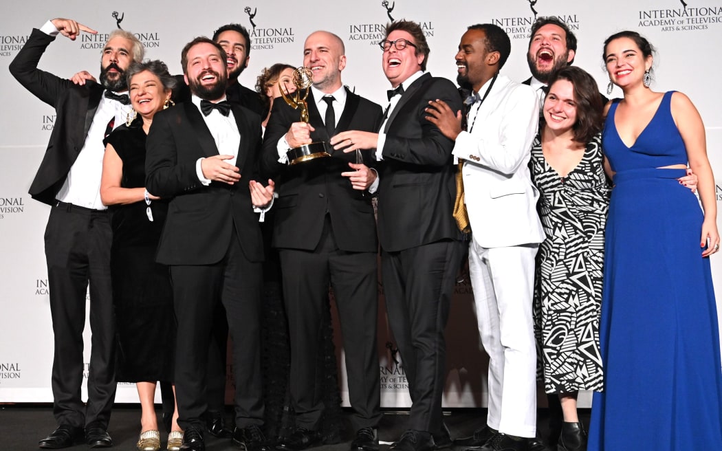 Writer Fabio Porchat, (C), poses with the "Especial de Natal Porta dos Fundos," crew in celebration of their best comedy award during the 2019 International Emmy Awards Gala on November 25, 2019 in New York City.