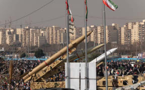 Iranian missiles and an unmanned aerial vehicle (UAV), Shahed-136, are being displayed at the Azadi (Freedom) Square in western Tehran during a rally to mark the 45th anniversary of the victory of Iran's 1979 Islamic Revolution, on February 11, 2024. The Iranian Islamic Revolution, which led to the overthrow of the Pahlavi dynasty in 1979, replaced the Imperial State of Iran with the present-day Islamic Republic of Iran. (Photo by Morteza Nikoubazl/NurPhoto) (Photo by Morteza Nikoubazl / NurPhoto / NurPhoto via AFP)