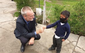 Rory Truell in Pakistan in early March, with a boy explaining why the coronavirus is scary.