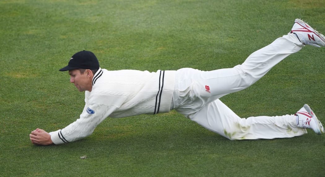 Trent Boult takes a catch to dismiss Rangana Herath on day three of the first cricket Test vs Sri Lanka at University Oval, Dunedin, 12 December 2015. Copyright photo: Andrew Cornaga / www.photosport.nz