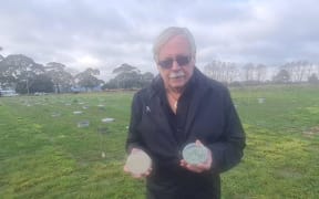 John Hampton with prill, left, and seed coated in fungus on the right