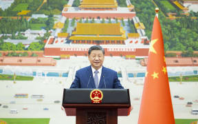 Chinese President Xi Jinping delivers a speech at the Great Hall of the People in Beijing, on 12 December, 2024.
