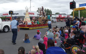 The Ojibwe costumes were removed from the float after complaints, but the cowboys and horses remained.
