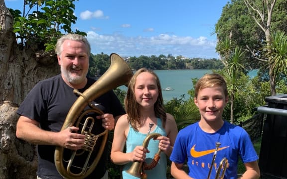 Simon O'Neill with his Bayreuth Kaiserhorn gives his children a brass instrument lesson.
