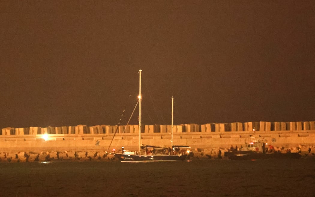 A picture shows the aid sailboat Madleen at the southern port of Ashdod after being intercepted by Israeli forces on June 9, 2025. Israeli forces intercepted the Gaza-bound aid boat Madleen, operated by the Freedom Flotilla Coalition activist group, on June 9, preventing the activists on board from reaching the blockaded Palestinian territory. (Photo by Jack GUEZ / AFP)