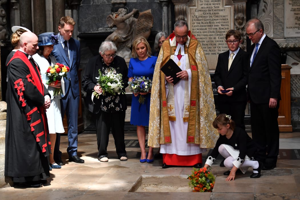 Dean of Westminster, John Hall, accompanied by first wife Jane Hawking and daughter Lucy Hawking presides over the internment of the ashes of Stephen Hawking during a memorial service at Westminster Abbey