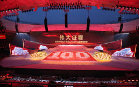People perform on the stage during the Great Conquest to celebrate the 100-year of the Chinese Communist Part at National Stadium, known as Birds' Nest in Beijing on June 29, 2021. The Communist Party of China, founded in Shanghai on July 1st has more than 90 million memebers.