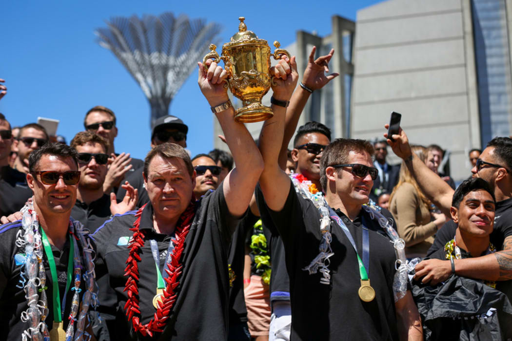 The All Blacks lift the Webb Ellis Cup in Wellington.