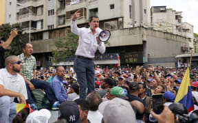 Venezuelan opposition leader and self-proclaimed acting president Juan Guaido speaks during a demo in Caracas on March 9, 2019