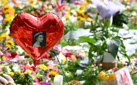 Floral tributes are pictured in Green Park, near Buckingham Palace, in London on September 11, 2022. - Charles III was formally proclaimed Britain's new king by the Accession Council on Saturday in a history-laden ceremony following the death of his mother Queen Elizabeth II.