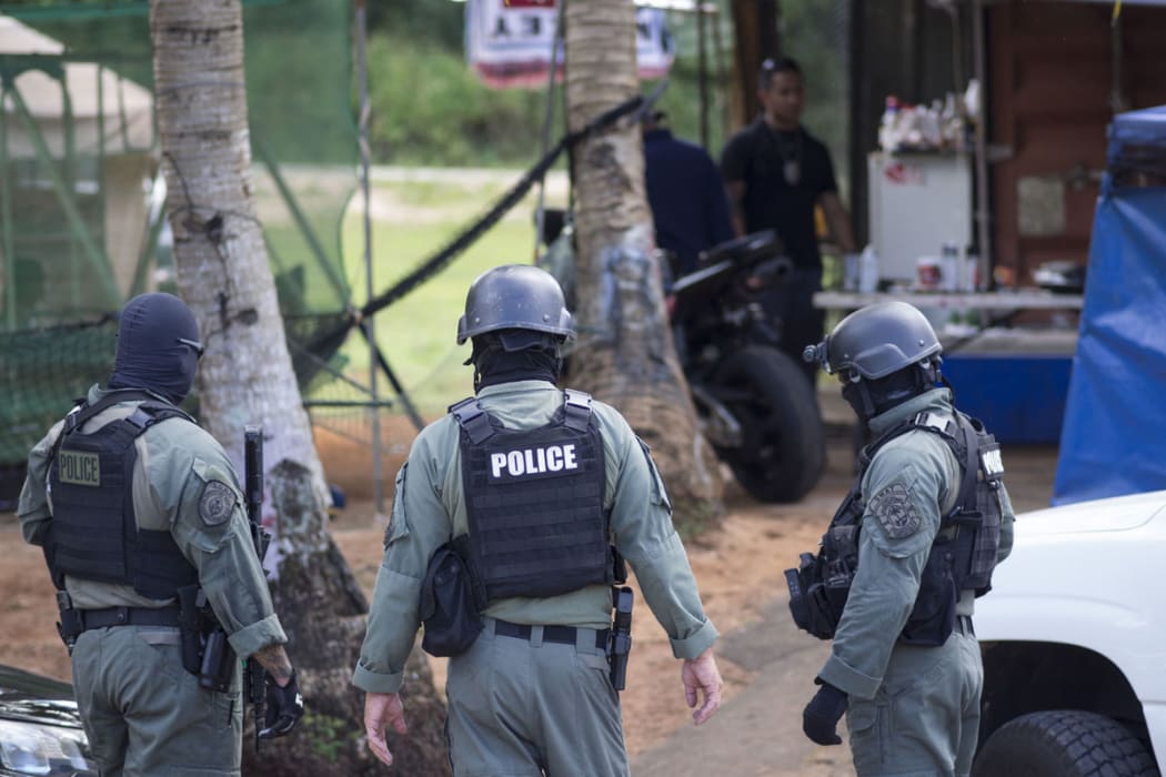 Guam SWAT officers execute a search warrant at a property on Chalan Dogga in Dededo on the 15th of July 2017.