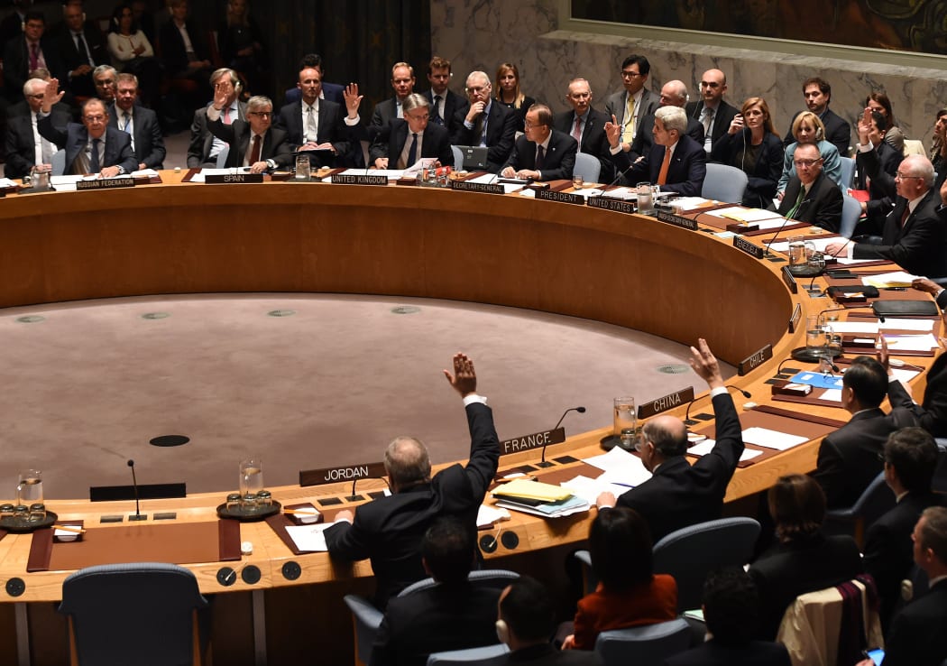 Foreign Ministers vote during a UN Security Council meeting on Syria