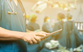 Male doctor,medical students or surgeon using digital tablet and laptop during the conference,Health Check with digital system support for patient,test results and patient registration,selective focus